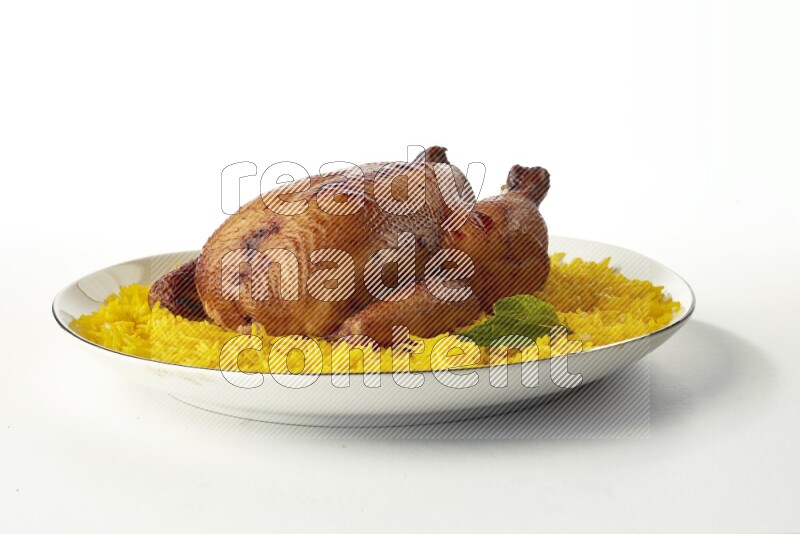 yellow  basmati Rice with kabsa chicken pieces on a white plate with a silver rim direct on white background