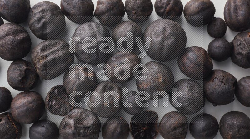 Top-view shot of dried lime (loomi) on white background