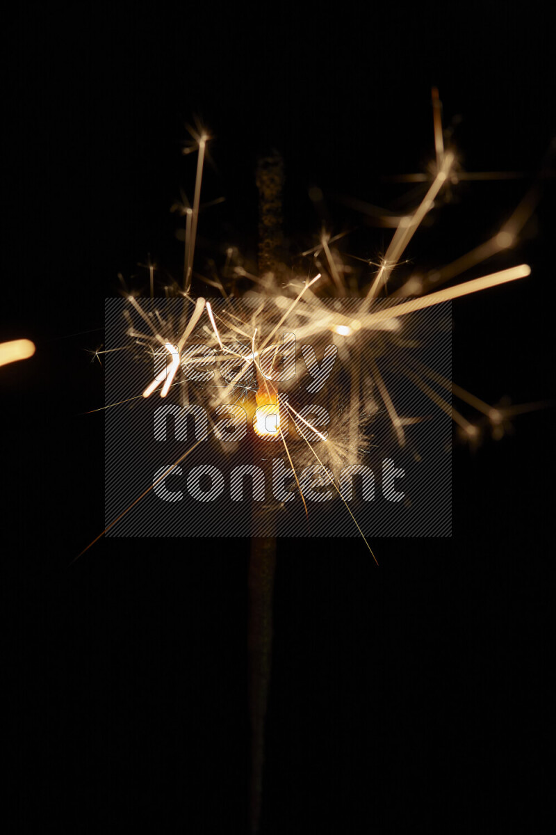 A close-up image of sparkler candle isolated on black background