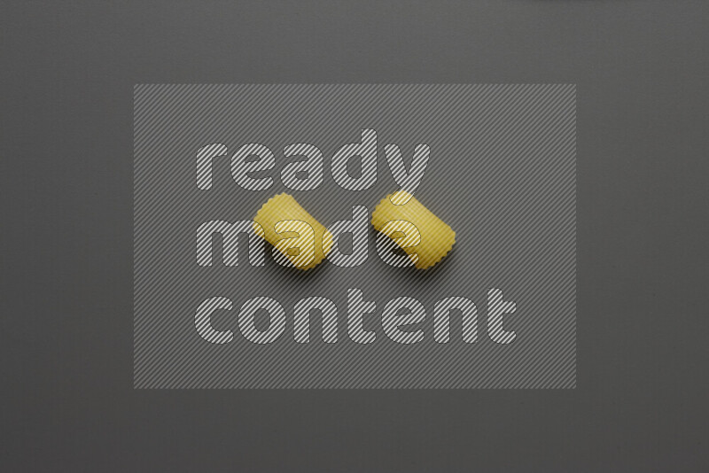 Elbow pasta on grey background