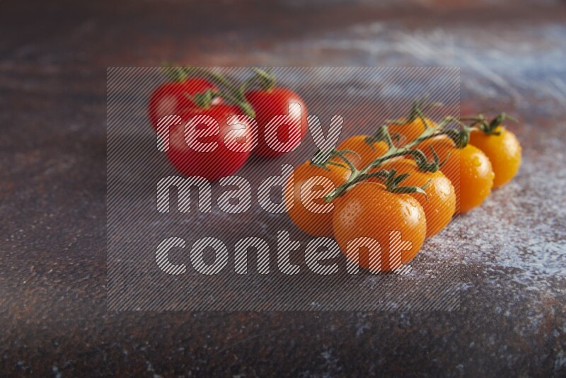 Mixed cherry tomato veins on a textured reddish rustic metal background 45 degree