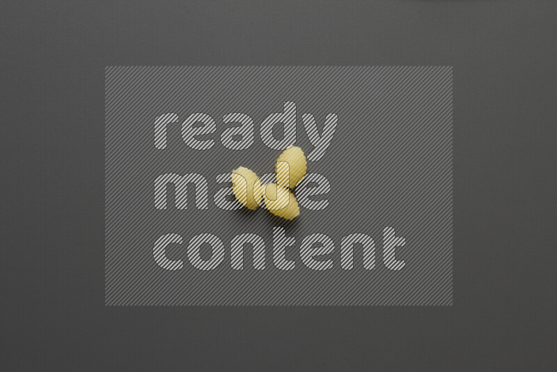 Shells pasta on grey background