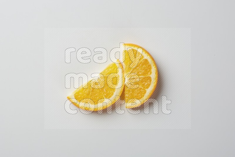 Two halves of an orange slices on white background