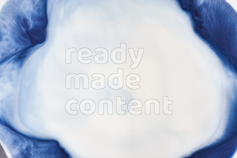 A close-up of abstract swirling patterns in blue and white