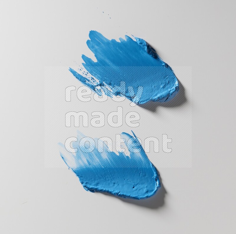 Blue painting knife strokes on white background