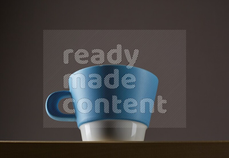 Low angle shot of a bicolor cup on grey background