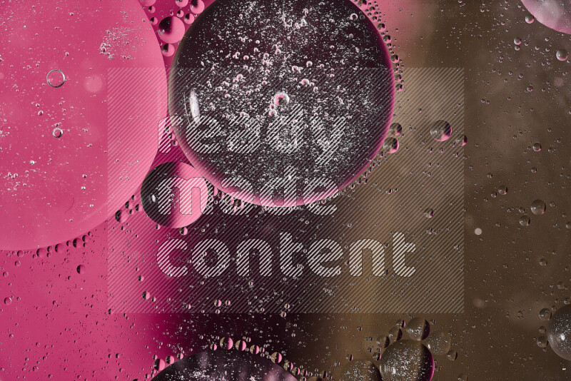 Close-ups of abstract oil bubbles on water surface in shades of pink and brown