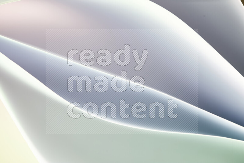 This image showcases an abstract paper art composition with paper curves in green and white gradients created by colored light