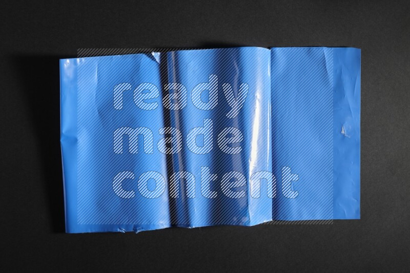 Colored plastic textures on black background