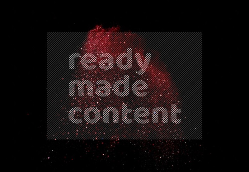 Red glitter powder isolated on black background