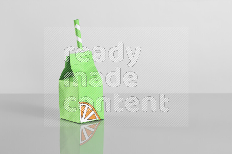 Origami juice box on grey background