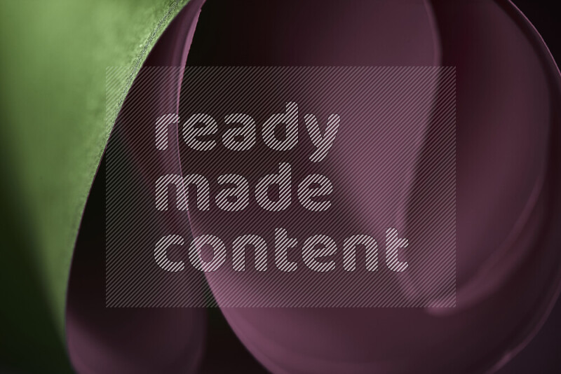 فن تجريدي يعرض منحنيات وتدرجات اللون الوردي والأخضر مكونه بضوء ملون