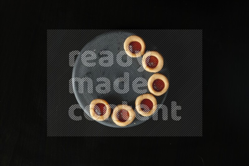 Jam cookies on a black background