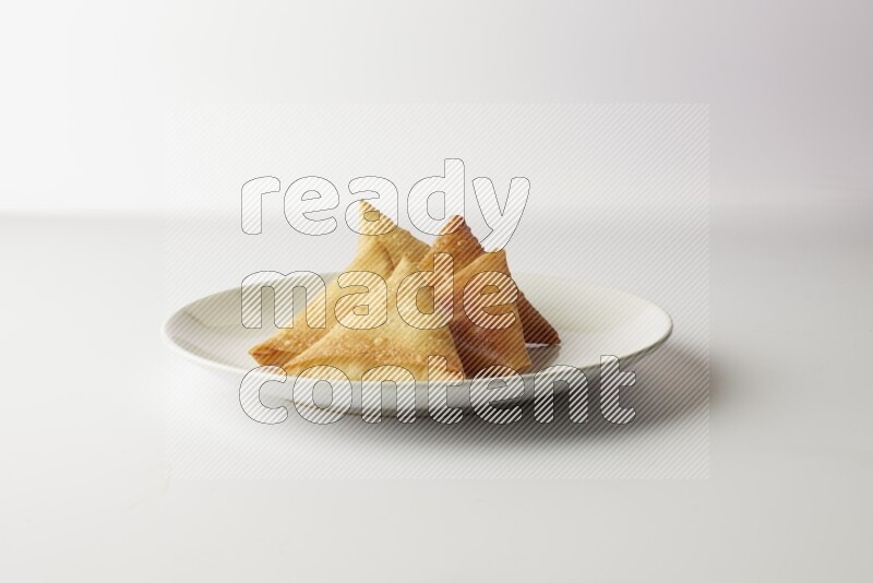 sambosas on a white background