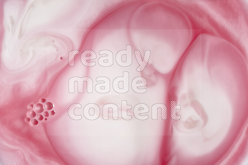 A close-up of abstract swirling patterns in red and white