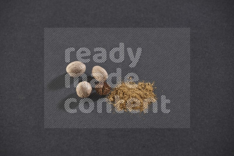 Nutmeg seeds with nutmeg powder beside it on a black flooring in different angles