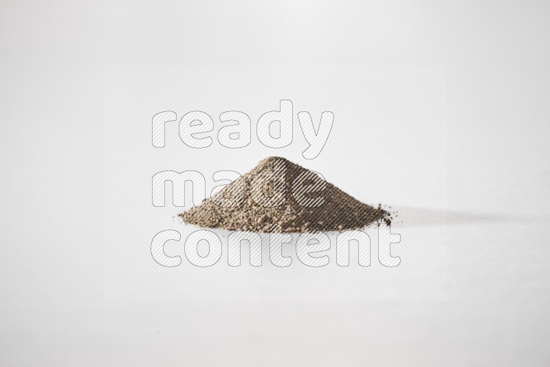 Black pepper powder on a white background