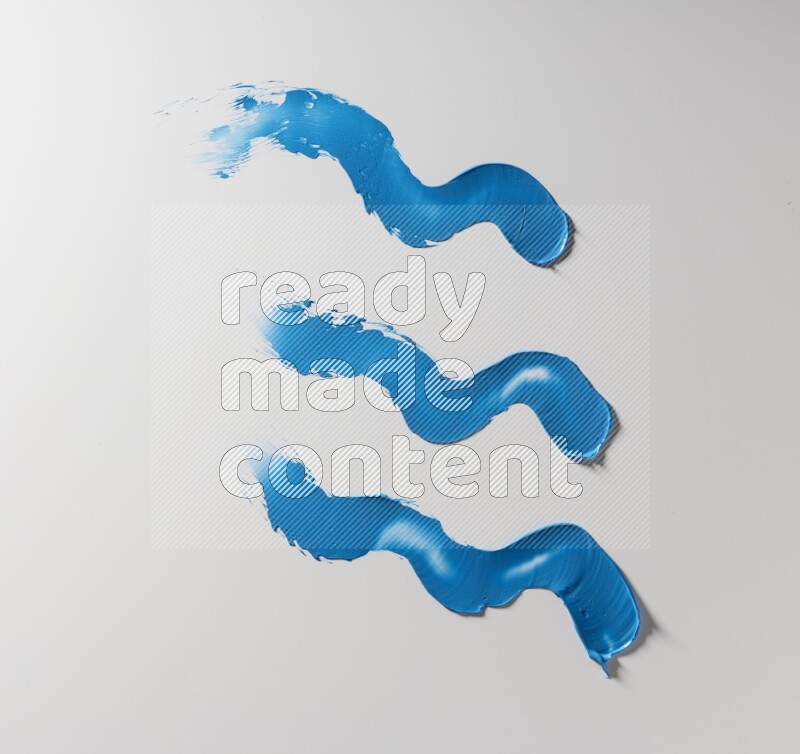 Blue zigzag painting knife strokes on white background