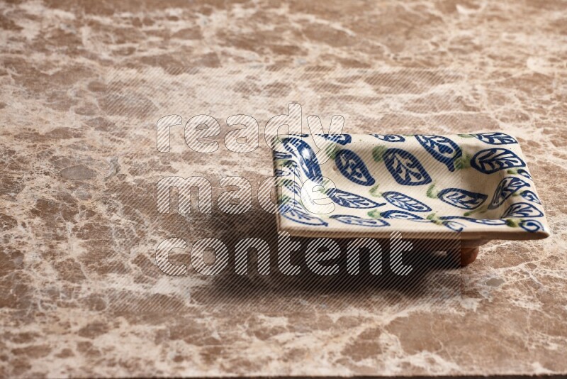 Decorative Pottery Plate on Beige Marble Flooring