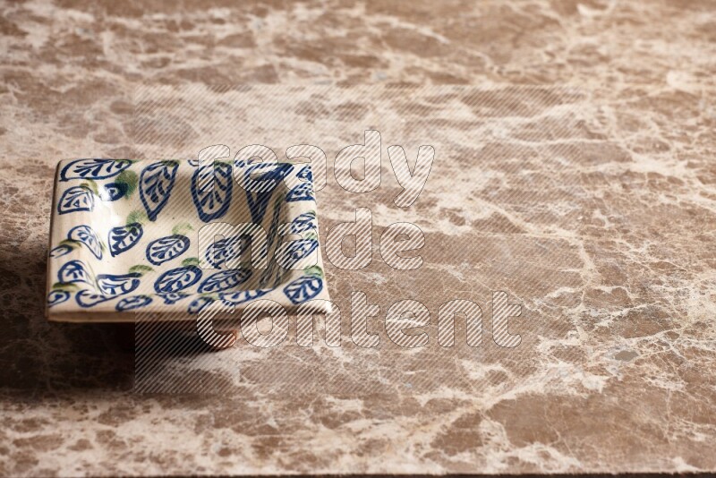 Decorative Pottery Plate on Beige Marble Flooring