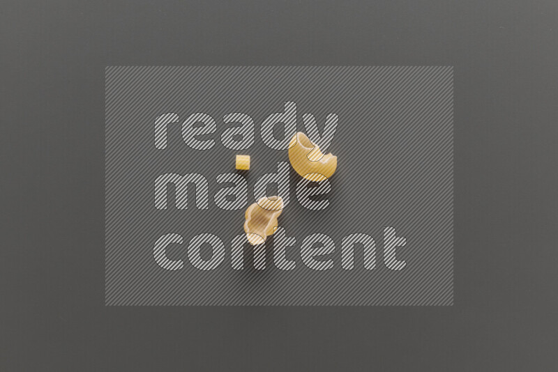 Different pasta types on grey background
