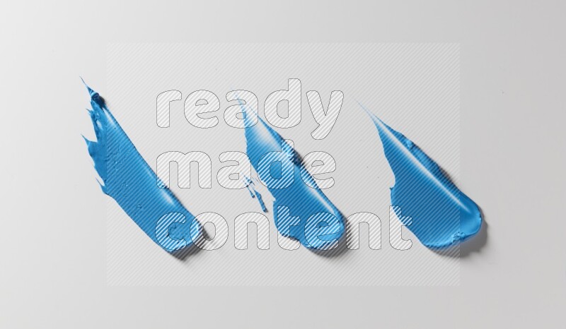 Blue painting knife strokes on white background