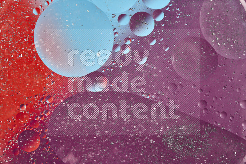 Close-ups of abstract oil bubbles on water surface in shades of blue, red and purple