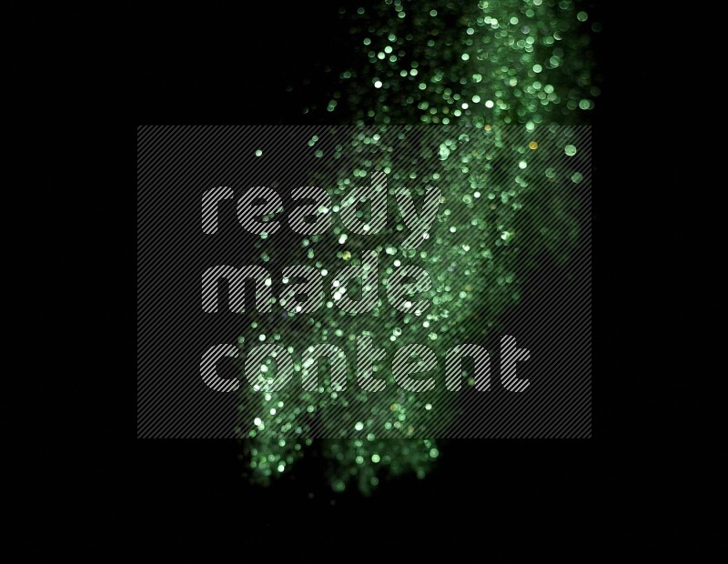 Green glitter powder isolated on black background