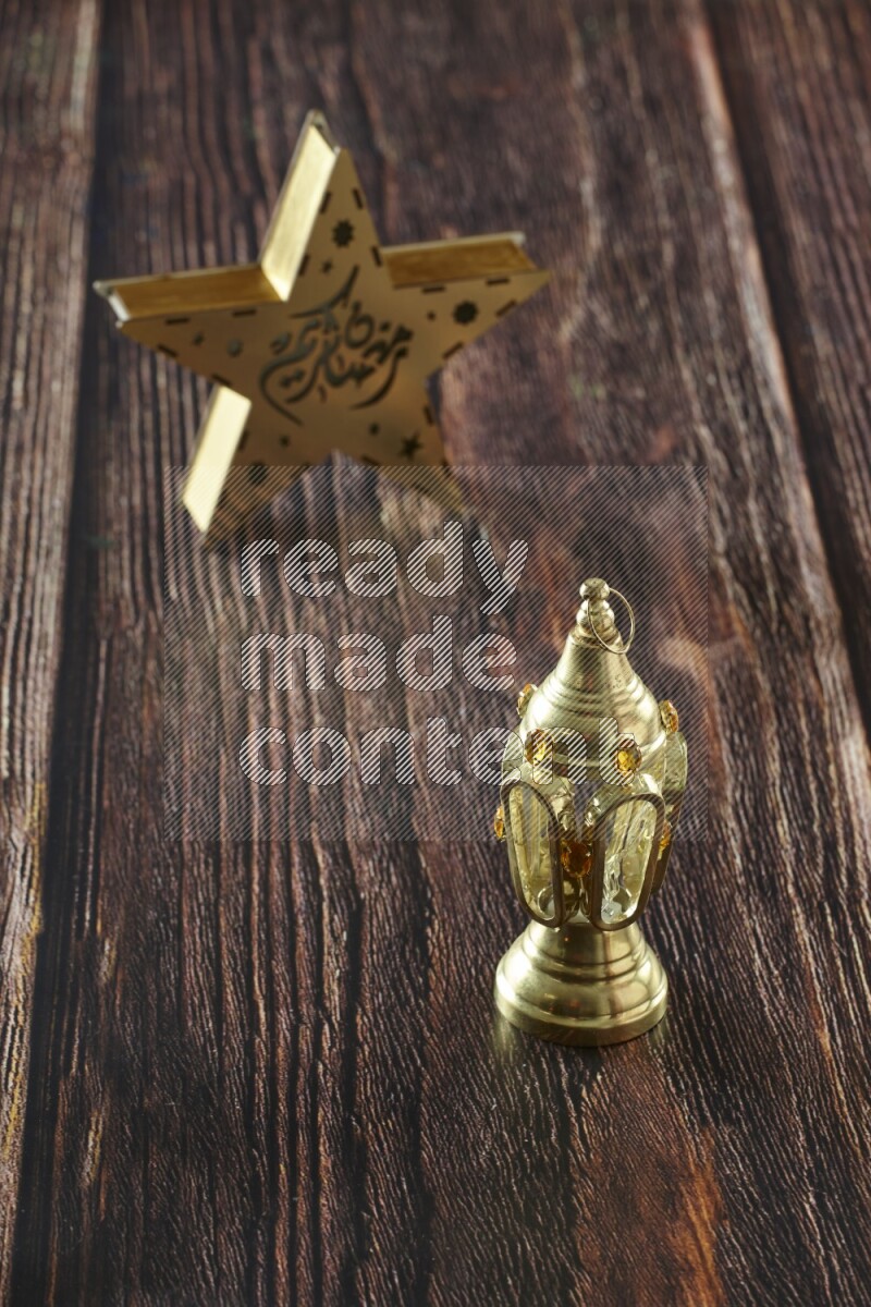 A star lantern with classic lantern on brown wooden background