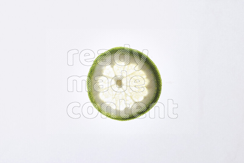 Orange slices on illuminated white background
