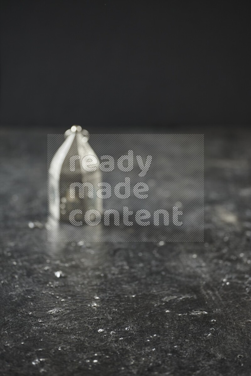 An out of focus lantern on textured black background