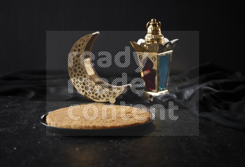 Konafa with lanterns in a dark setup