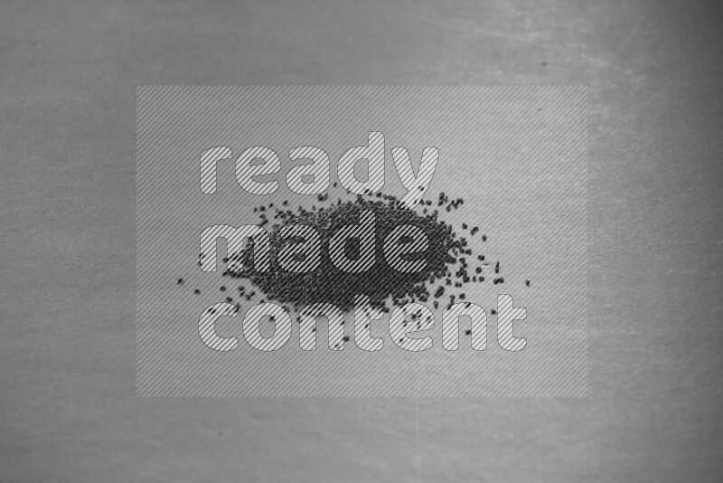 Black seeds on a black flooring