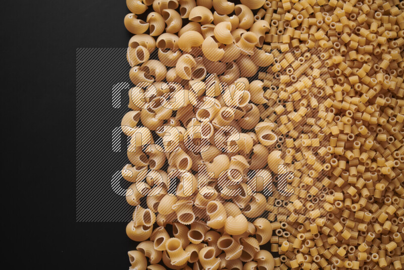 Different pasta types on black background