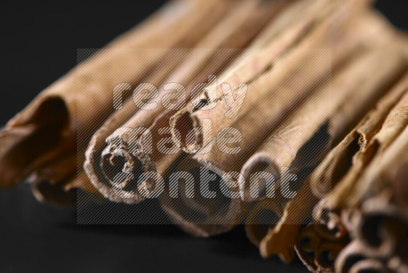 Cinnamon sticks on black background