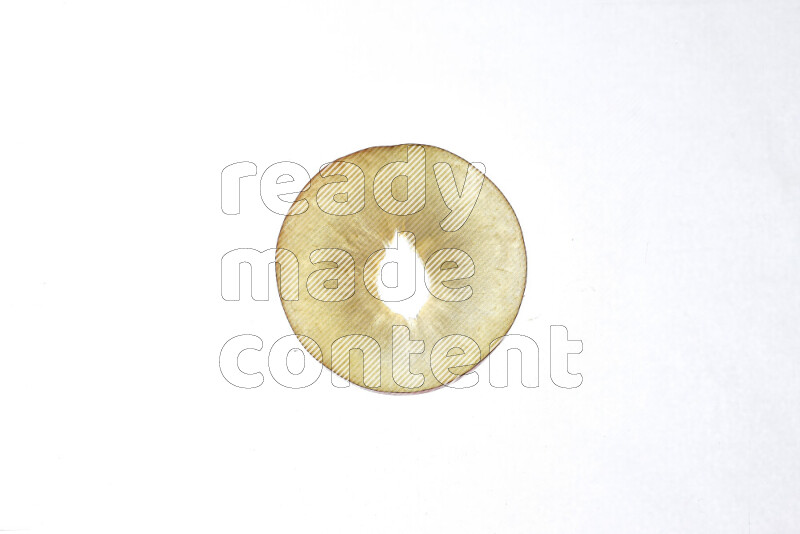 Peach slices on illuminated white background