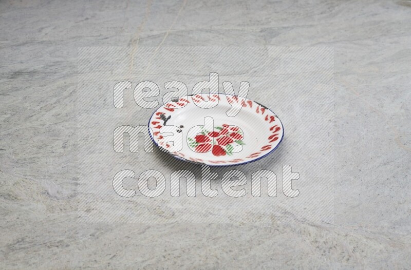 A vintage metal plate on grey marble background