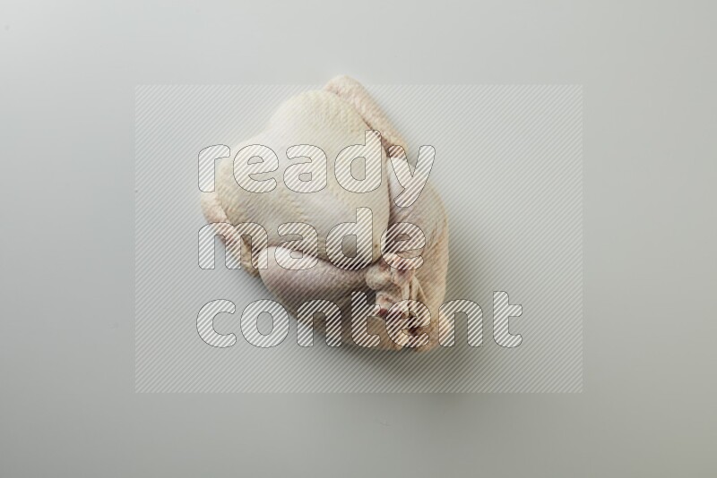 Whole fresh chicken direct on a white background