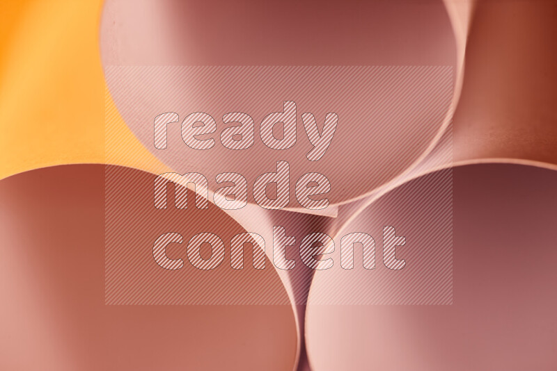 The image shows an abstract paper art with circular shapes in varying shades of orange