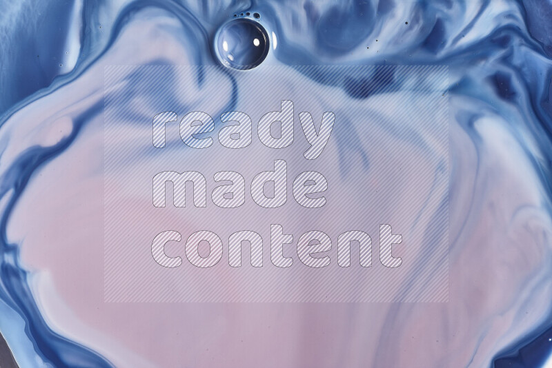 A close-up of abstract swirling patterns in blue, red and white