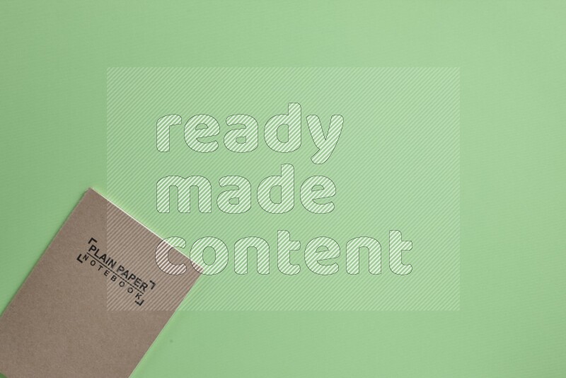 A notebook on green background