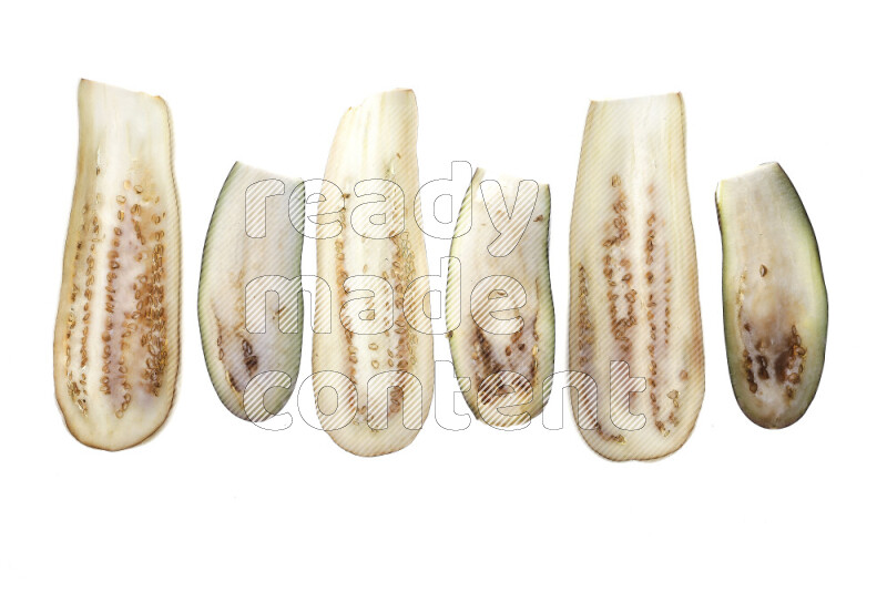 Eggplant slices on illuminated white background