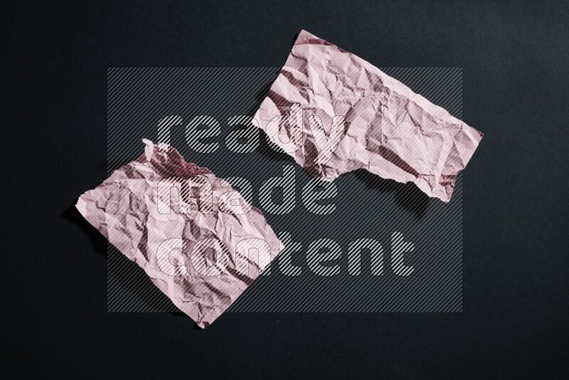 Pink paper sheet on black background