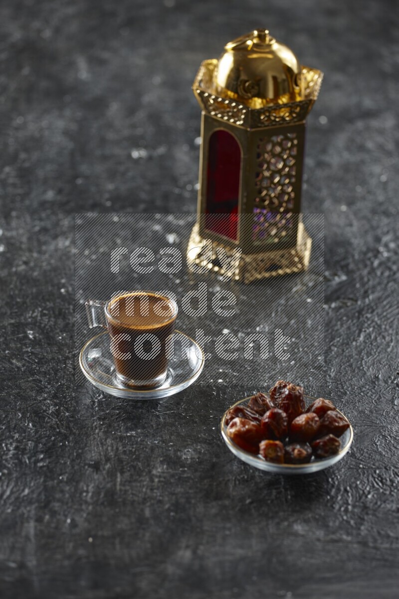 A golden lantern with different drinks, dates, nuts, prayer beads and quran on textured black background