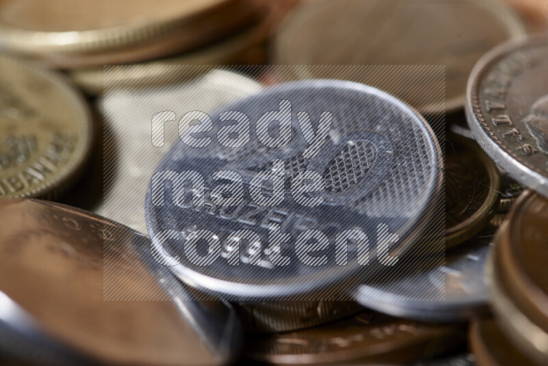 A close-ups of random old coins on black background