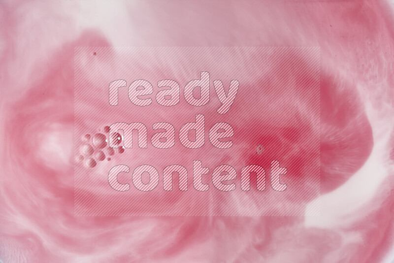 A close-up of abstract swirling patterns in red and white