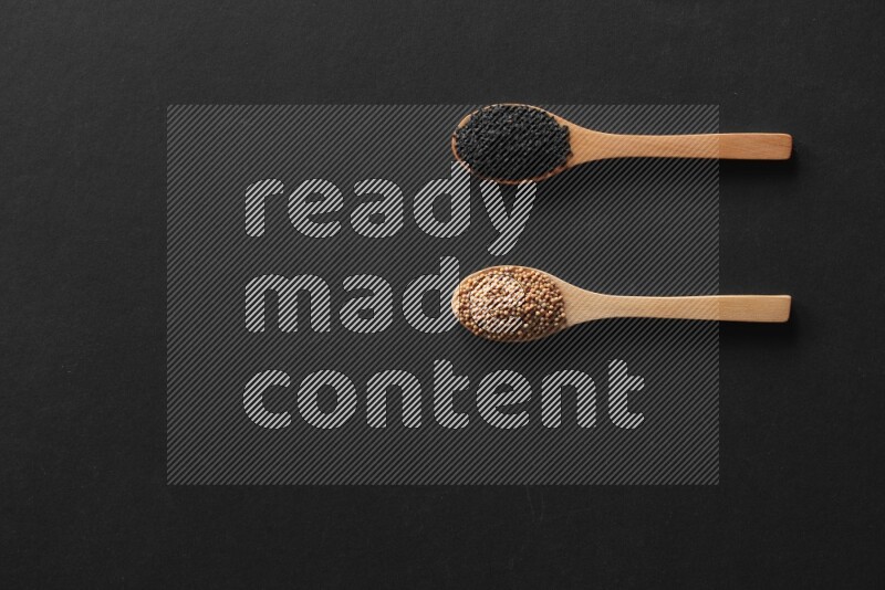 wooden spoons filled with white peppers, mustard seeds, black seeds, garden cress, cumin and flax on black flooring