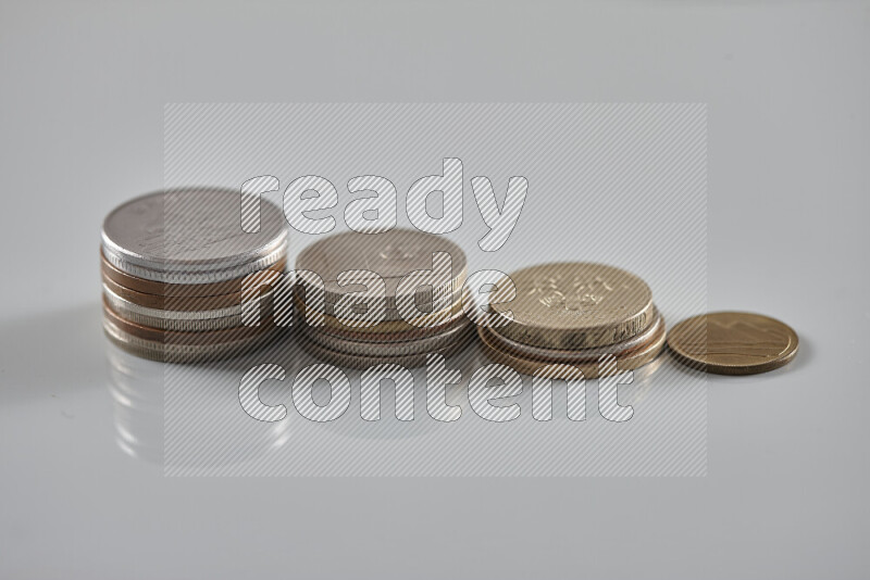 Random old coins on grey background
