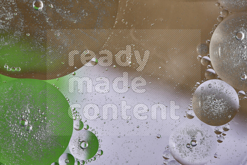 Close-ups of abstract oil bubbles on water surface in shades of brown, green and white